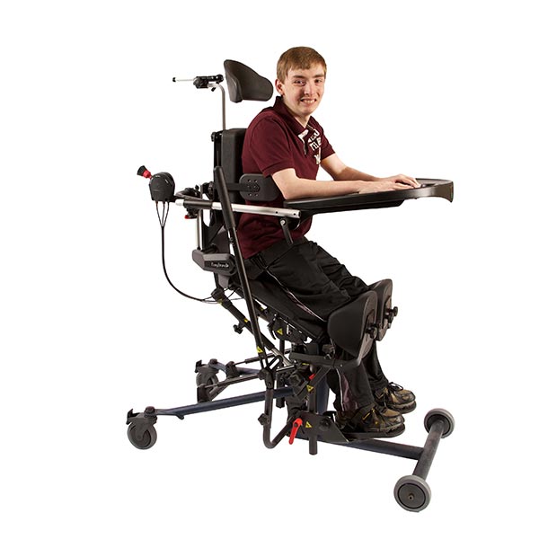 Teenage child in the EasyStand Bantam standing frame in standing position