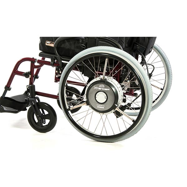 Sunrise Medical Quickie Xtender Electric Assist Wheelchair Accessory attached to a rigid wheelchair